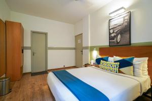 Postel nebo postele na pokoji v ubytování Olive Hotel Magrath by Embassy Group