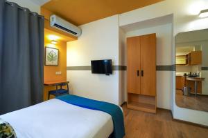 TV a/nebo společenská místnost v ubytování Olive Hotel Magrath by Embassy Group