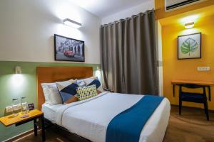 Postel nebo postele na pokoji v ubytování Olive Hotel Magrath by Embassy Group