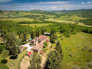 an aerial view of a home in the hills at Podere le Rote in Castelnuovo di Val di Cecina