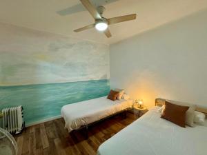 A bed or beds in a room at Apartamento del Mar