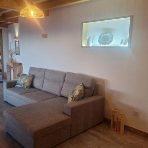 a living room with a couch and a window at Casa Carballo in Puxedo