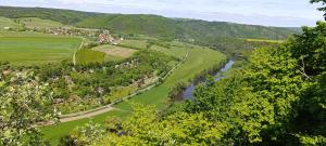 an aerial view of a valley with a river at Tee-pee u Honzíka in Zbečno