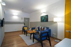 TV a/nebo společenská místnost v ubytování Olive Hotel Magrath by Embassy Group
