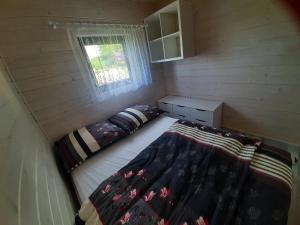 Postel nebo postele na pokoji v ubytování Wichrowa Skarpa