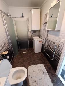 Koupelna v ubytování Centralt hus + 9 fotografií