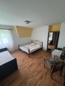 Postel nebo postele na pokoji v ubytování Penzion Karolín