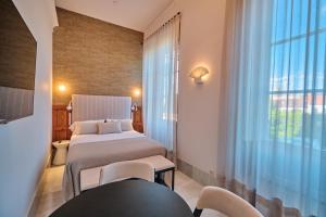 Ein Bett oder Betten in einem Zimmer der Unterkunft Hotel Gaio 7