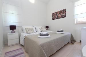 Postel nebo postele na pokoji v ubytování Apartments Makado