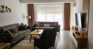 Posezení v ubytování Value Living Apartment