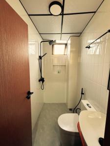 a bathroom with a toilet and a sink at Ruka Maldives in Dhiffushi +48 photos