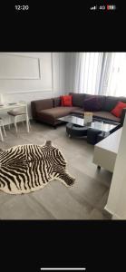 a zebra rug in a living room with a couch at Studio luxueux et contemporain in Casablanca