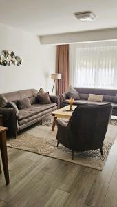 Posezení v ubytování Value Living Apartment
