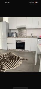 a zebra rug on the floor of a kitchen at Studio luxueux et contemporain in Casablanca