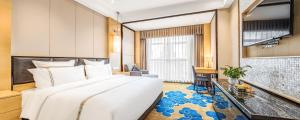 Voodi või voodid majutusasutuse Lyhn International Hotel Chengdu Taikoo Li toas
