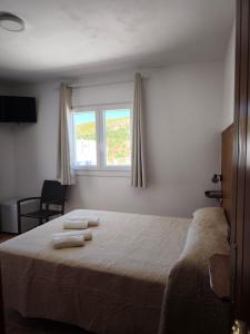Posteľ alebo postele v izbe v ubytovaní Hostal Jadraza