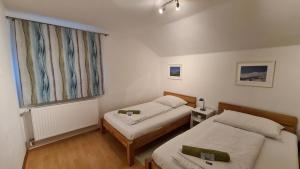 Postel nebo postele na pokoji v ubytování HH-Apartments