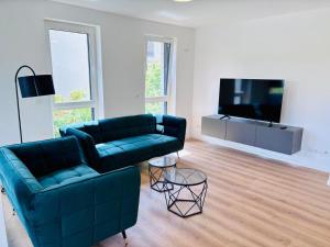 Μια τηλεόραση ή/και κέντρο ψυχαγωγίας στο C Homes - Apartments & Lofts