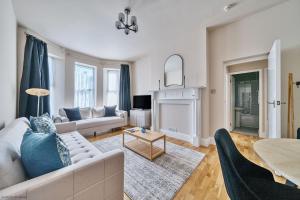 a living room with a couch and a table at Number 5 in Margate