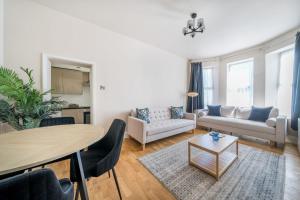 a living room with a table and a couch at Number 5 in Margate