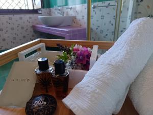 a room with a bed with flowers on a table at Il Maestrale B&B in Castellabate