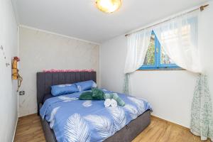 Łóżko lub łóżka w pokoju w obiekcie Holiday house Depope