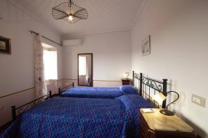 Voodi või voodid majutusasutuse La Suite di Arpino toas