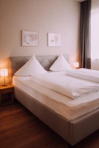 Postel nebo postele na pokoji v ubytování Europa Residenz Bad Füssing