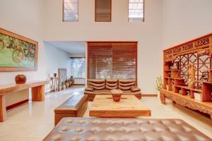 a living room with a couch and a table at Collection O near MRT Cipete Raya formerly Terogong Sembilan in Jakarta +31 photos