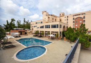 a view of a building with a swimming pool at The African Regent Hotel in Accra