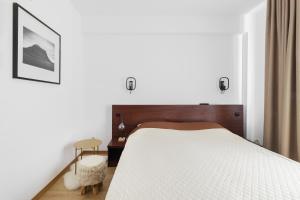 Postel nebo postele na pokoji v ubytování Hotel Piatra Soimului