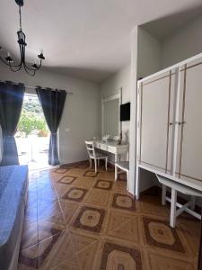 a room with a table and a bed and a dining room at Dionysia Studios in Kefalos