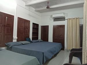 Postel nebo postele na pokoji v ubytování Ramaya Homestay