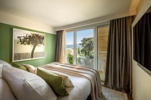 Postel nebo postele na pokoji v ubytování Girandella Resort, Valamar Collection + 37 fotografií