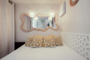 Кровать или кровати в номере Cap d'Agde Studio - Village naturiste
