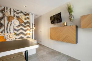 Телевизор и/или развлекательный центр в Cap d'Agde Studio - Village naturiste