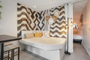 Кровать или кровати в номере Cap d'Agde Studio - Village naturiste