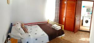 Łóżko lub łóżka w pokoju w obiekcie Casa Nazario Duplex