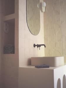 a bathroom with a sink and a mirror at PROVENCE VAR Bel appartement 2 pièces indépendant dans un Magnifique Domaine in Bras +14 photos