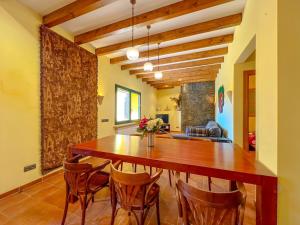 a dining room with a wooden table and chairs at Holiday Home in Palamós near the Beach in Palamós