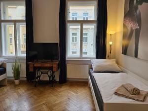 Postel nebo postele na pokoji v ubytování Slezska Apartments