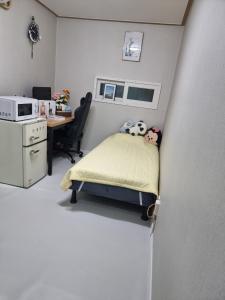Postel nebo postele na pokoji v ubytování Halla Livingtel