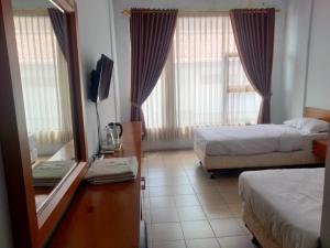 Postelja oz. postelje v sobi nastanitve tekMIRA Hotel