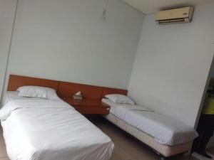 Postelja oz. postelje v sobi nastanitve tekMIRA Hotel
