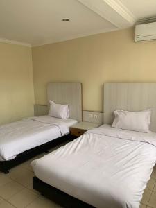 Postelja oz. postelje v sobi nastanitve tekMIRA Hotel
