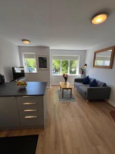 a living room with a couch and a table at 112 Clifden Glen in Clifden