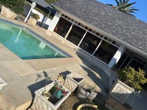 an overhead view of a house with a swimming pool at His Oath Guesthouse in Potchefstroom