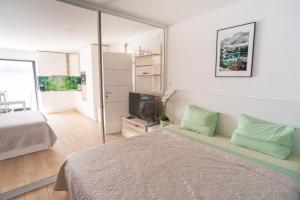 Postel nebo postele na pokoji v ubytování Apartments Palada 1