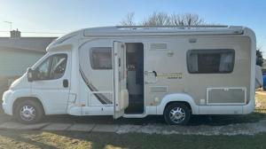 a white camper van parked in a parking lot at Izzie The Glampervan in Faversham +5 photos
