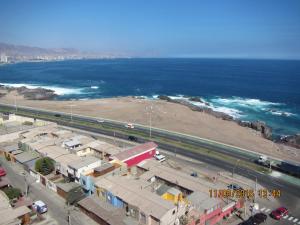 an aerial view of a parking lot next to the ocean at Departamentos Parque Costanera in Antofagasta